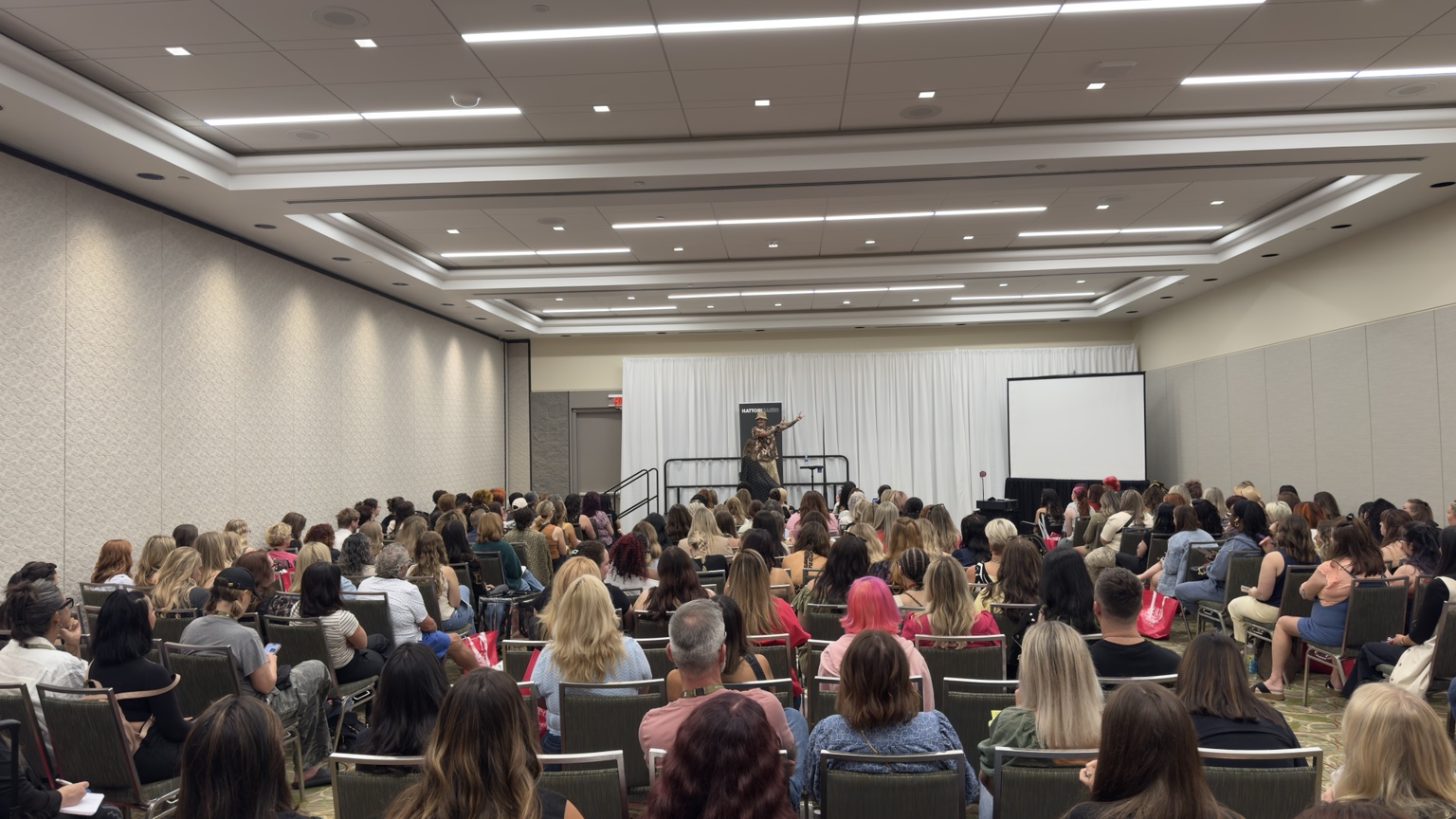 Collin Martin teaching a packed education room